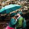 kissing under umbrella