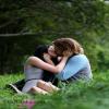 kissing in grass ground